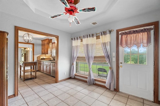 813 N Council Rd Unit S, Newcastle, OK 73065 - foyer with plenty of natural light, light tile patterned floors, ceiling fan, and a chandelier