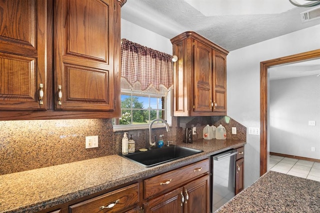 813 N Council Rd Unit S, Newcastle, OK 73065 - kitchen featuring dishwasher, decorative backsplash, light tile patterned flooring, and brown cabinets