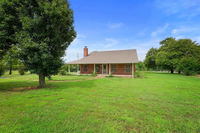 813 N Council Rd Unit S, Newcastle, OK 73065 - view of front facade with a chimney, a front lawn, covered porch, and brick siding