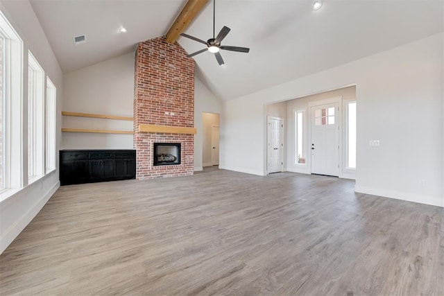 4163 Hawthorne St, Piedmont, OK 73078 - unfurnished living room with a ceiling fan, beamed ceiling, light wood finished floors, a brick fireplace, and high vaulted ceiling