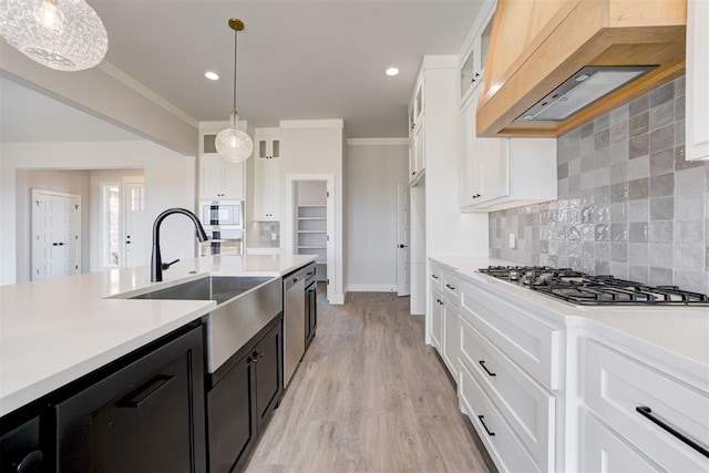 4163 Hawthorne St, Piedmont, OK 73078 - kitchen featuring appliances with stainless steel finishes, premium range hood, dark cabinetry, light countertops, and white cabinetry