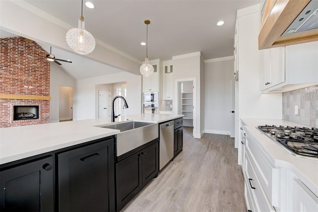 4163 Hawthorne St, Piedmont, OK 73078 - kitchen featuring custom exhaust hood, dark cabinetry, stainless steel appliances, white cabinets, and light countertops