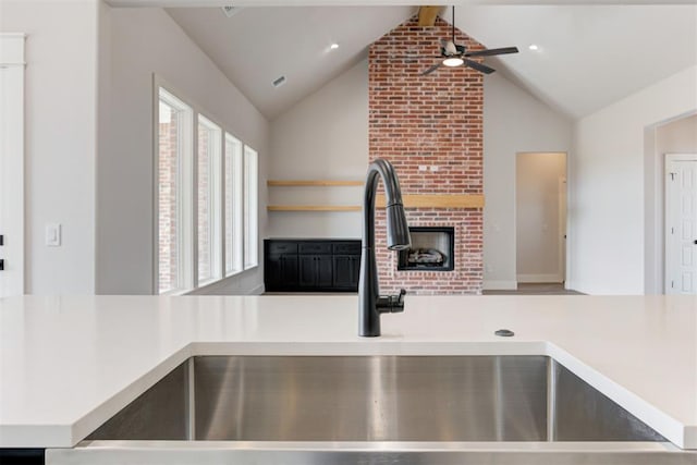 4163 Hawthorne St, Piedmont, OK 73078 - kitchen with a ceiling fan, healthy amount of natural light, a fireplace, high vaulted ceiling, and light countertops