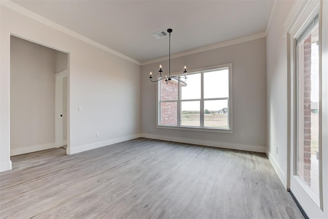 4163 Hawthorne St, Piedmont, OK 73078 - unfurnished dining area featuring light wood-type flooring, a chandelier, ornamental molding, and plenty of natural light