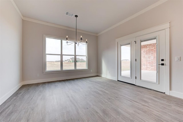 4163 Hawthorne St, Piedmont, OK 73078 - unfurnished dining area featuring ornamental molding, a chandelier, and wood finished floors