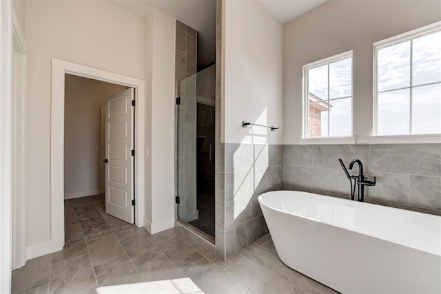 4163 Hawthorne St, Piedmont, OK 73078 - bathroom featuring a stall shower, a soaking tub, and tile walls