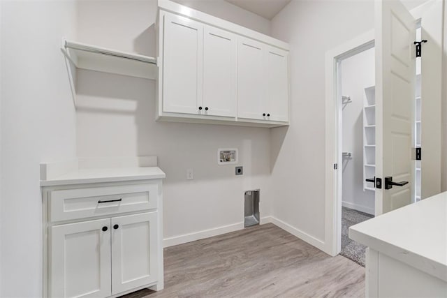 4163 Hawthorne St, Piedmont, OK 73078 - washroom with cabinet space, electric dryer hookup, hookup for a washing machine, and light wood-style flooring