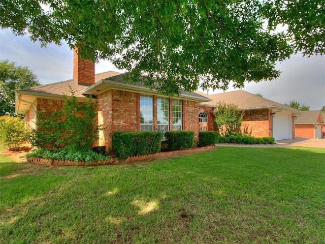 1204 Scrambler Ln, Edmond, OK 73025 - ranch-style home featuring a chimney, brick siding, a front lawn, a garage, and concrete driveway