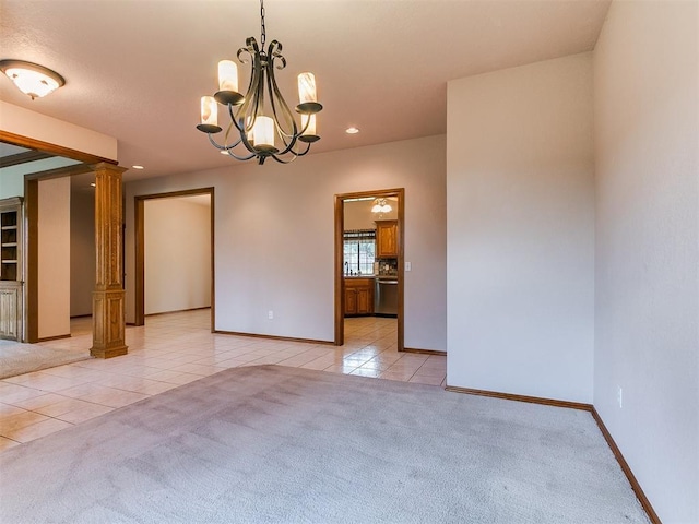 1204 Scrambler Ln, Edmond, OK 73025 - spare room featuring light tile patterned floors, decorative columns, recessed lighting, light colored carpet, and a chandelier