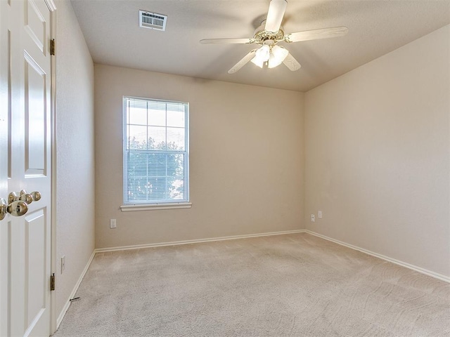1204 Scrambler Ln, Edmond, OK 73025 - empty room with light carpet and ceiling fan