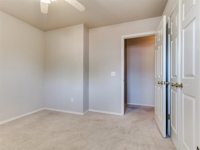 1204 Scrambler Ln, Edmond, OK 73025 - unfurnished room with light carpet and a ceiling fan