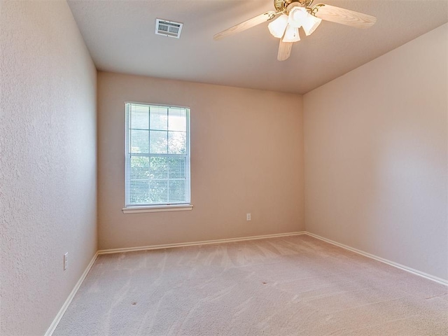 1204 Scrambler Ln, Edmond, OK 73025 - unfurnished room with light colored carpet and ceiling fan