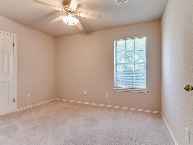 1204 Scrambler Ln, Edmond, OK 73025 - unfurnished room with light colored carpet and ceiling fan