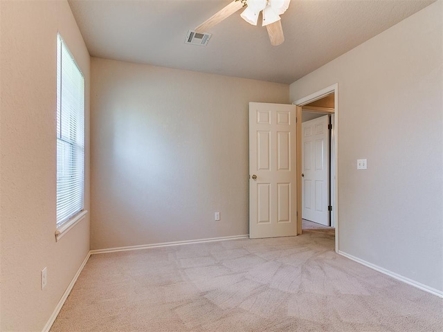 1204 Scrambler Ln, Edmond, OK 73025 - unfurnished room featuring plenty of natural light, carpet, and ceiling fan