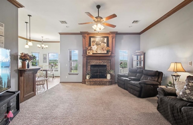 7732 Jesse Trl, Oklahoma City, OK 73150 - carpeted living room with crown molding, a brick fireplace, healthy amount of natural light, a chandelier, and a ceiling fan