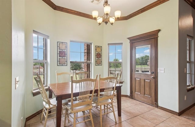 7732 Jesse Trl, Oklahoma City, OK 73150 - dining space featuring a chandelier, ornamental molding, and light tile patterned floors