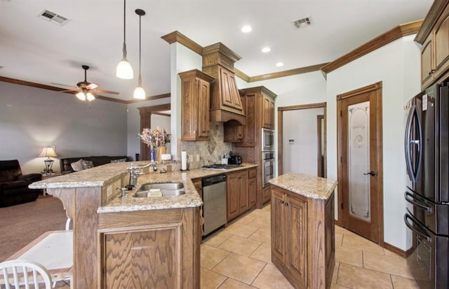 7732 Jesse Trl, Oklahoma City, OK 73150 - kitchen featuring stainless steel appliances, a peninsula, ornamental molding, open floor plan, and ceiling fan