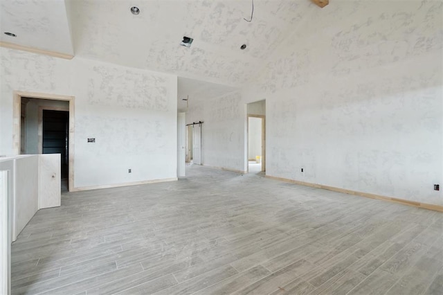 41364 Hazel Dell Rd, Shawnee, OK 74804 - spare room featuring light wood-style floors and high vaulted ceiling
