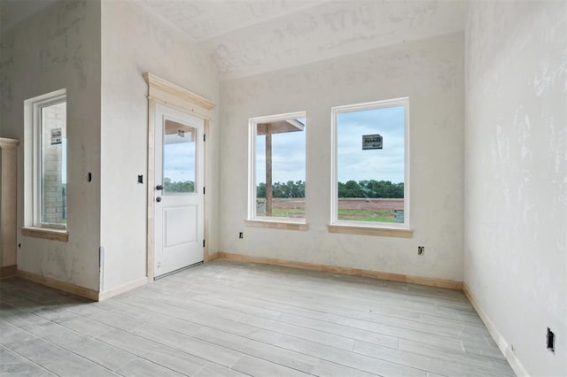 41364 Hazel Dell Rd, Shawnee, OK 74804 - spare room with light wood-style floors and lofted ceiling