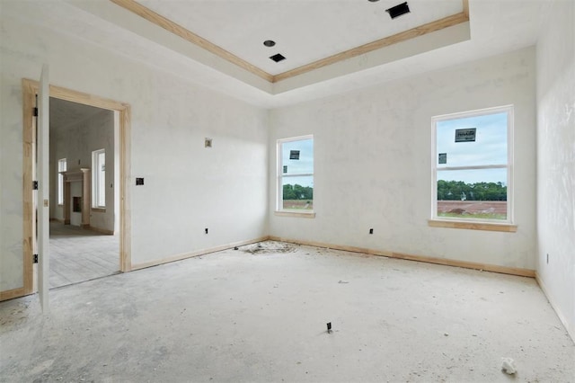 41364 Hazel Dell Rd, Shawnee, OK 74804 - unfurnished room with a tray ceiling and ornamental molding