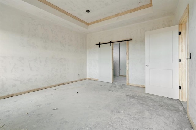 41364 Hazel Dell Rd, Shawnee, OK 74804 - unfurnished bedroom featuring crown molding, a barn door, and a raised ceiling