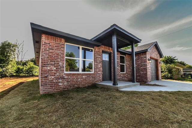 1417 Mallard Dr, Del City, OK 73115 - ranch-style house featuring driveway, a garage, a front lawn, and brick siding