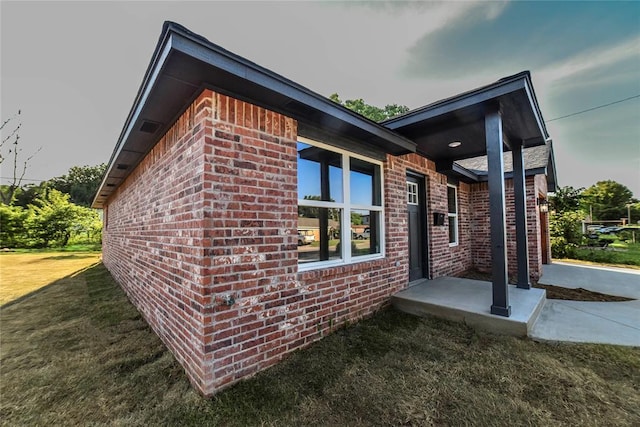 1417 Mallard Dr, Del City, OK 73115 - view of property exterior featuring brick siding and a yard