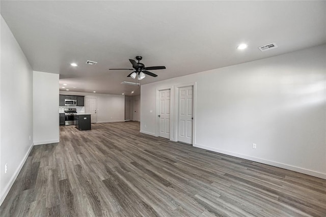 1417 Mallard Dr, Del City, OK 73115 - unfurnished living room with recessed lighting, dark wood-style flooring, and a ceiling fan