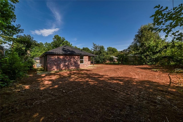 1417 Mallard Dr, Del City, OK 73115 - view of home's exterior with brick siding and a shingled roof