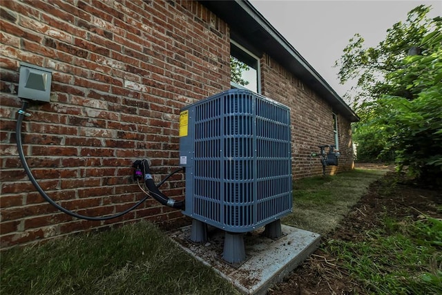 1417 Mallard Dr, Del City, OK 73115 - exterior view of brick siding and a central air condition unit