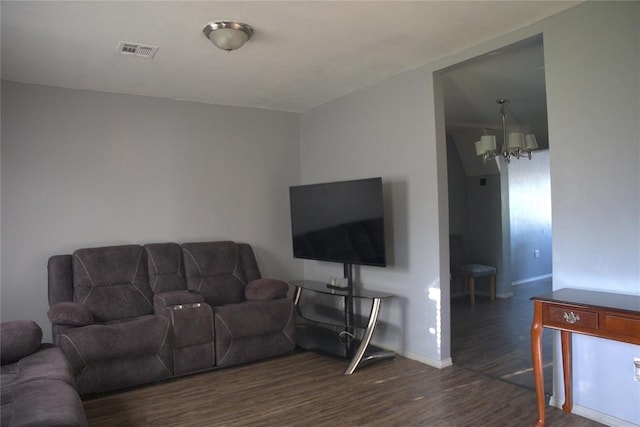 9008 N Walker Ave, Oklahoma City, OK 73103 - living room featuring dark wood-style flooring and a chandelier