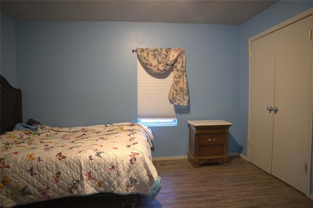 9008 N Walker Ave, Oklahoma City, OK 73103 - bedroom with wood finished floors and baseboards