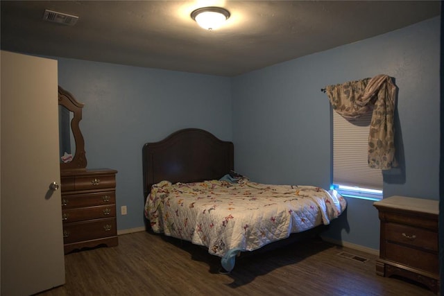 9008 N Walker Ave, Oklahoma City, OK 73103 - bedroom with wood finished floors and baseboards