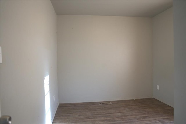 9008 N Walker Ave, Oklahoma City, OK 73103 - empty room with wood finished floors and baseboards