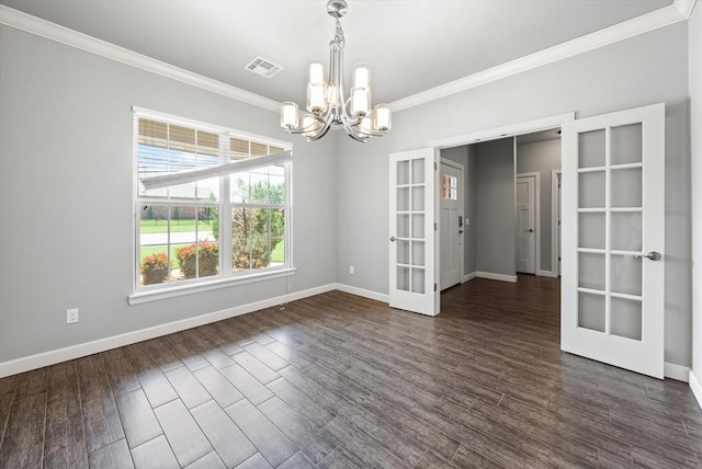 641 Geneva Dr, Edmond, OK 73025 - unfurnished room featuring french doors, a chandelier, crown molding, and dark wood-type flooring