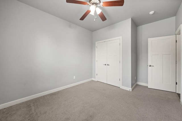 641 Geneva Dr, Edmond, OK 73025 - unfurnished bedroom with carpet floors, a closet, and ceiling fan