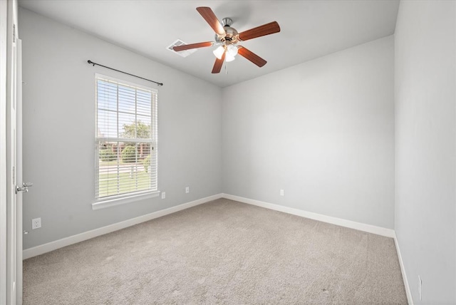 641 Geneva Dr, Edmond, OK 73025 - carpeted spare room with baseboards and ceiling fan