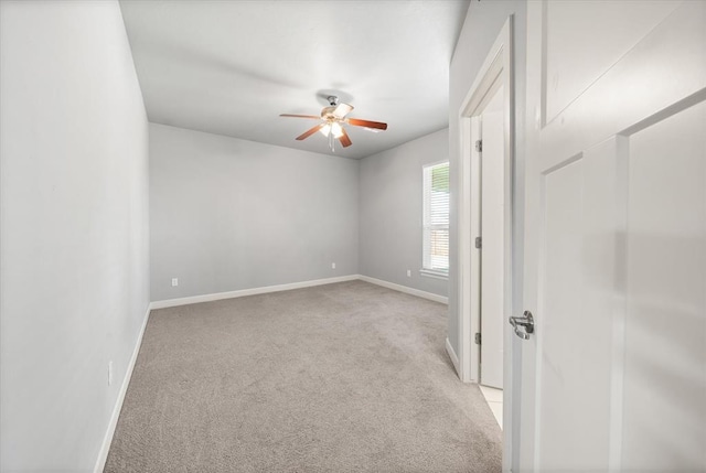 641 Geneva Dr, Edmond, OK 73025 - empty room with light carpet and ceiling fan