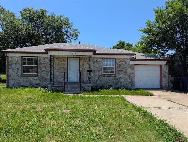 1516 SW 44th St, Oklahoma City, OK 73119 - view of front of property featuring stone siding, concrete driveway, a garage, and a front lawn