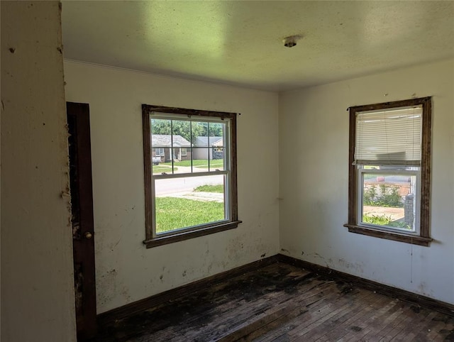 1516 SW 44th St, Oklahoma City, OK 73119 - unfurnished room featuring dark wood-style floors and a textured ceiling