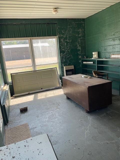 1403 W Columbia St, Okemah, OK 74859 - bedroom featuring unfinished concrete flooring