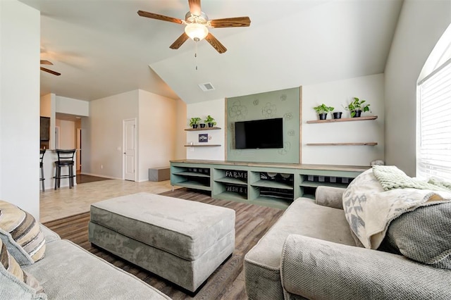 1109 Hickory Creek Dr, Yukon, OK 73099 - living room with ceiling fan, vaulted ceiling, and wood finished floors