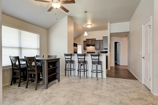 1109 Hickory Creek Dr, Yukon, OK 73099 - dining area with ceiling fan, healthy amount of natural light, and vaulted ceiling