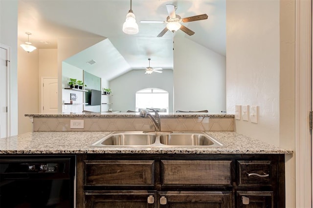 1109 Hickory Creek Dr, Yukon, OK 73099 - kitchen with black dishwasher, dark brown cabinetry, a ceiling fan, lofted ceiling, and light stone countertops