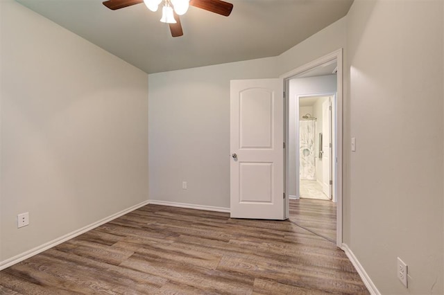 1109 Hickory Creek Dr, Yukon, OK 73099 - empty room with ceiling fan and wood finished floors
