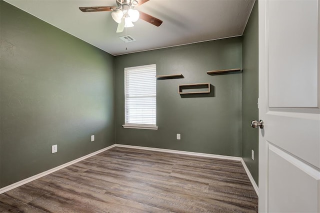 1109 Hickory Creek Dr, Yukon, OK 73099 - unfurnished room featuring a ceiling fan and wood finished floors