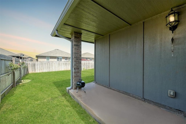 1109 Hickory Creek Dr, Yukon, OK 73099 - fenced backyard with a patio area