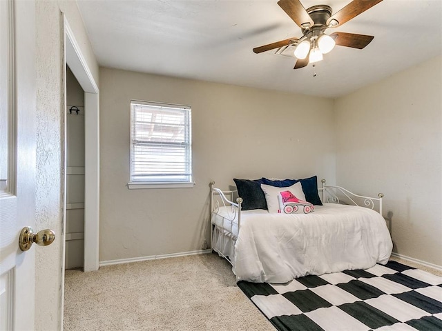 2349 Fox Ln, Blanchard, OK 73010 - carpeted bedroom featuring baseboards and a ceiling fan