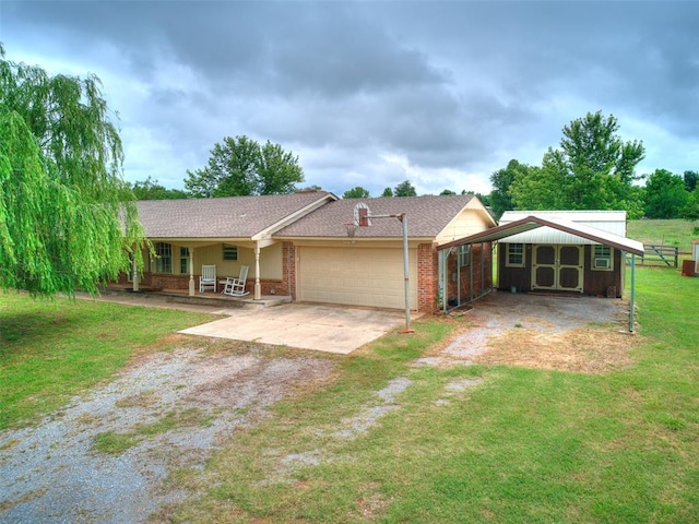 2349 Fox Ln, Blanchard, OK 73010 - view of front of house with driveway, an attached garage, a front lawn, brick siding, and covered porch
