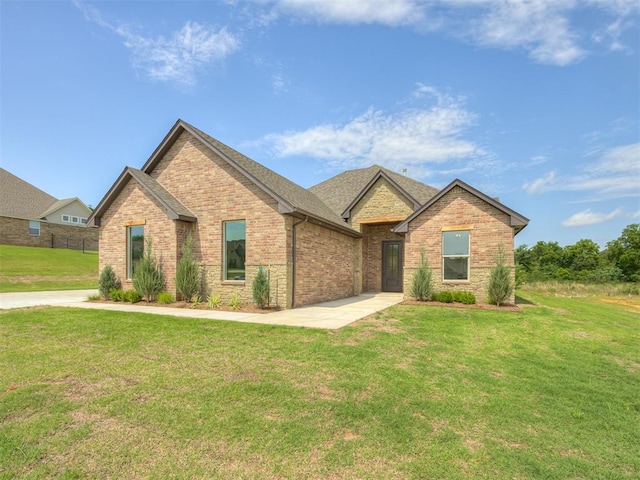 7625 Leoma Ln, Oklahoma City, OK 73150 - view of front of home with brick siding and a front yard